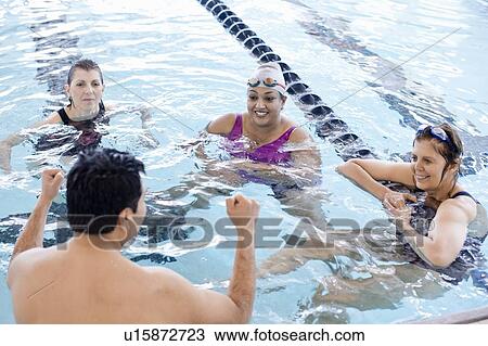 People relaxing in swimming pool View Large Photo Image Stock Image - People relaxing in swimming pool. Fotosearch