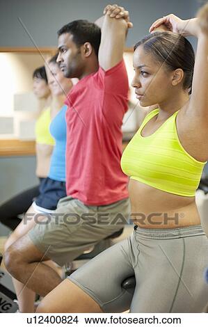 People stretching on spin machines View Large Photo Image Picture - People stretching on spin machines. Fotosearch