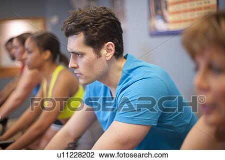 People using spin machines in gym View Large Photo Image Stock Image - People using spin machines in gym. Fotosearch
