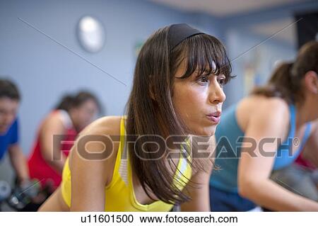 People using spin machines in gym View Large Photo Image Stock Image - People using spin machines in gym. Fotosearch