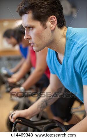 People using spin machines in gym View Large Photo Image Stock Image - People using spin machines in gym. Fotosearch