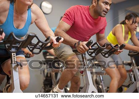 People using spin machines in gym View Large Photo Image Stock Image - People using spin machines in gym. Fotosearch