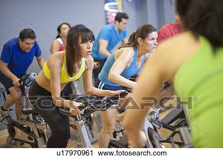 People using spin machines in gym View Large Photo Image Stock Image - People using spin machines in gym. Fotosearch