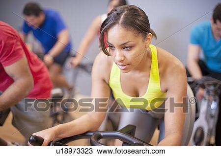 People using spin machines in gym View Large Photo Image Stock Image - People using spin machines in gym. Fotosearch