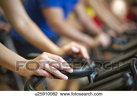 People using spin machines in gym View Large Photo Image Stock Image - People using spin machines in gym. Fotosearch