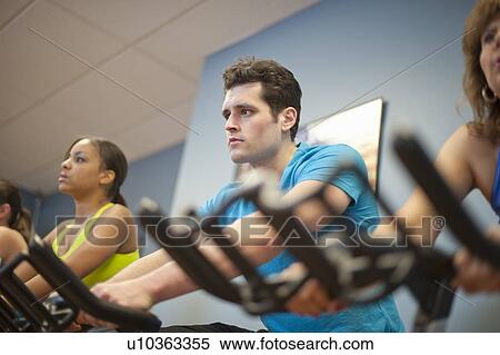 People using spin machines in gym View Large Photo Image Stock Photography - People using spin machines in gym. Fotosearch
