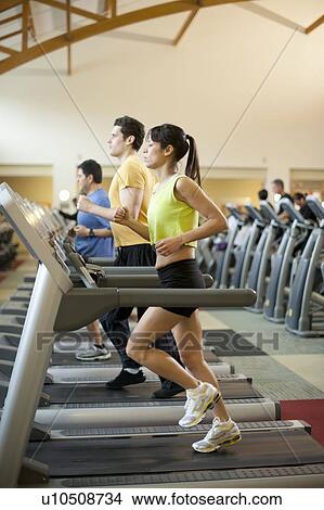 People using treadmills in gym View Large Photo Image Picture - People using treadmills in gym. Fotosearch
