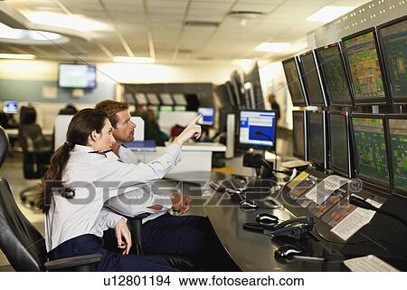 Picture - People working in security control room. Fotosearch