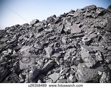 Stock Photo - Piles of coal at mine. Fotosearch