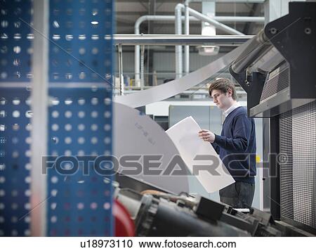 Printer holding paper at press View Large Photo Image Stock Image - Printer holding paper at press. Fotosearch