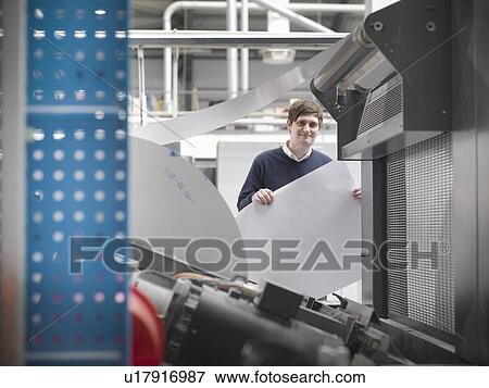 Printer holding paper at press View Large Photo Image Stock Photo - Printer holding paper at press. Fotosearch
