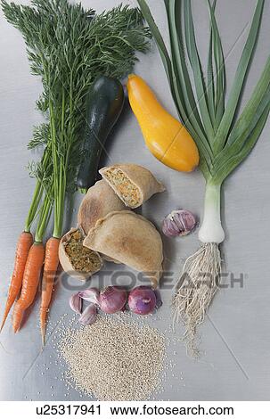Raw vegetables with empanadas (Latin American pasties) View Large Photo Image Stock Image - Raw vegetables with empanadas (Latin American pasties). Fotosearch