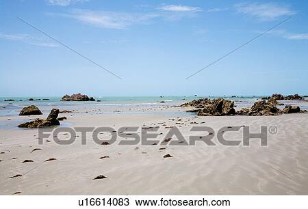 Stock Image - Rocks on sandy beach, Canoa Quebrada, Fortaleza, Brazil. Fotosearch