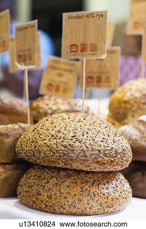 Round seeded rye bread for sale View Large Photo Image Picture - Round seeded rye bread for sale. Fotosearch