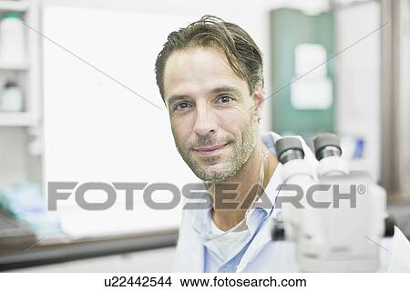 Scientist smiling in lab View Large Photo Image Picture - Scientist smiling in lab. Fotosearch