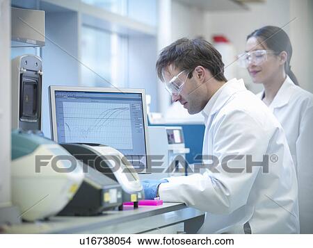 Picture - Scientist using computer in lab. Fotosearch