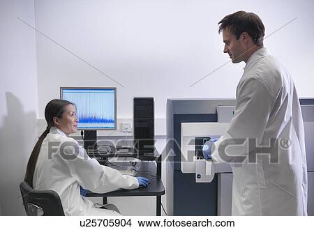 Scientist using computer in lab View Large Photo Image Picture - Scientist using computer in lab. Fotosearch