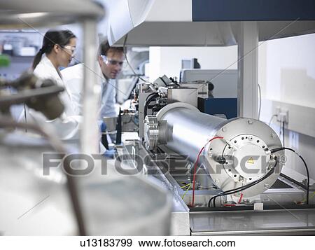 Scientist using equipment in lab View Large Photo Image Stock Photo - Scientist using equipment in lab. Fotosearch