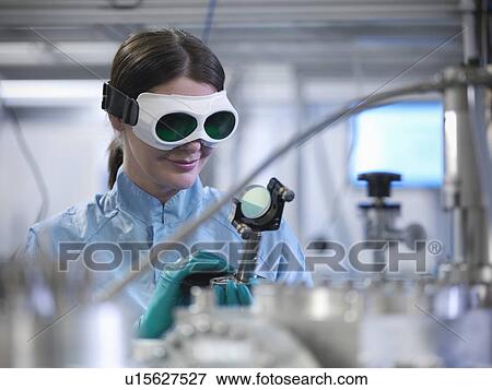Scientist using laser mirror in lab View Large Photo Image Stock Photo - Scientist using laser mirror in lab. Fotosearch
