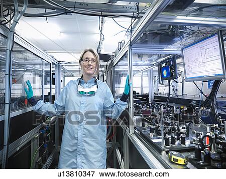 Stock Photo - Scientist walking in lab. Fotosearch