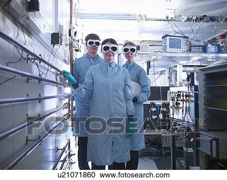 Scientists wearing goggles in lab View Large Photo Image Stock Image - Scientists wearing goggles in lab. Fotosearch