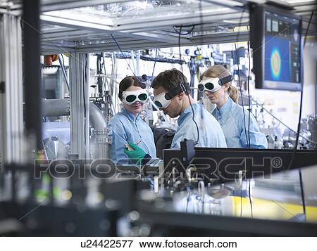 Stock Photo - Scientists working together in lab. Fotosearch