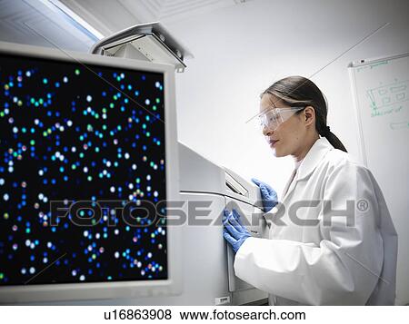 Stock Photo - Scientists working with printer in lab. Fotosearch