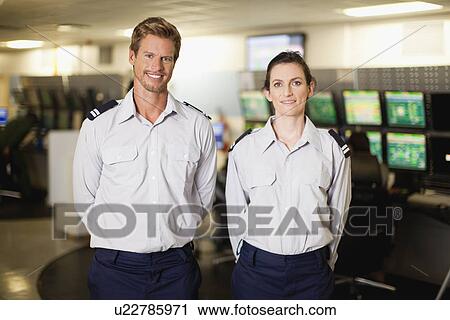 Security personnel in control room View Large Photo Image Stock Image - Security personnel in control room. Fotosearch