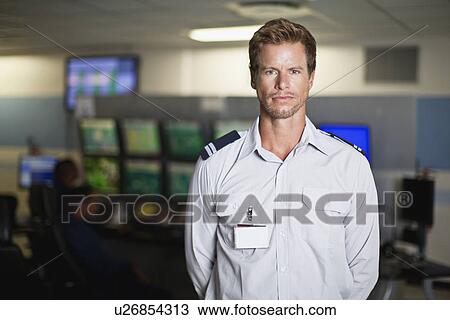 Security personnel in control room View Large Photo Image Stock Image - Security personnel in control room. Fotosearch