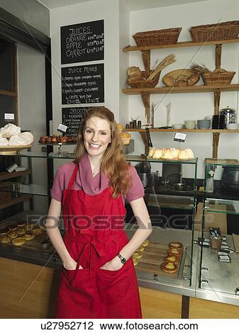 Server in front of bakery counter View Large Photo Image Stock Image - Server in front of bakery counter. Fotosearch