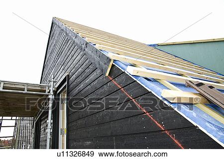 Stock Photo - Siding of building under construction. Fotosearch