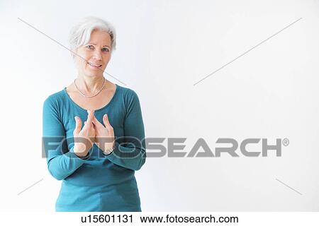 Smiling woman gesturing with hands View Large Photo Image Stock Image - Smiling woman gesturing with hands. Fotosearch