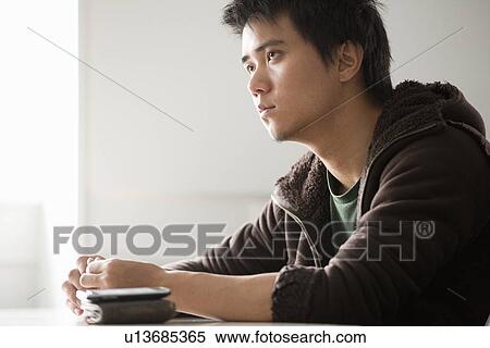Student sitting at desk in class View Large Photo Image Stock Photography - Student sitting at desk in class. Fotosearch