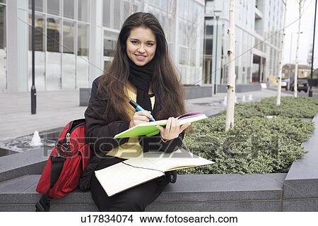 Student studying on city street View Large Photo Image Picture - Student studying on city street. Fotosearch