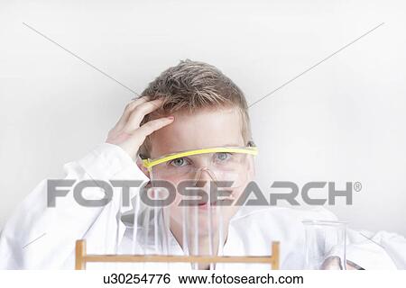 Stock Photograph - Student wearing safety goggles in lab. Fotosearch