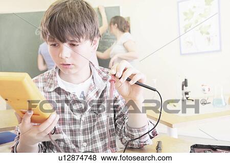 Student working in technology lab View Large Photo Image Stock Photo - Student working in technology lab. Fotosearch