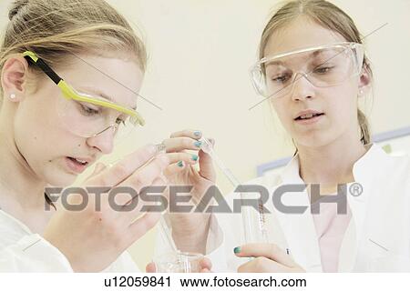 Students dropping liquid into test tube View Large Photo Image Stock Image - Students dropping liquid into test tube. Fotosearch