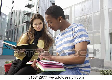 Stock Photo - Students studying on city street. Fotosearch