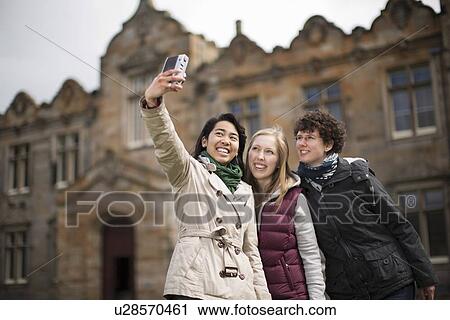Students taking pictures of themselves View Large Photo Image Stock Image - Students taking pictures of themselves. Fotosearch