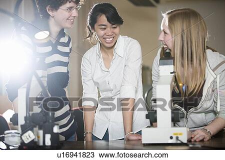 Students using microscope in lab View Large Photo Image Stock Image - Students using microscope in lab. Fotosearch