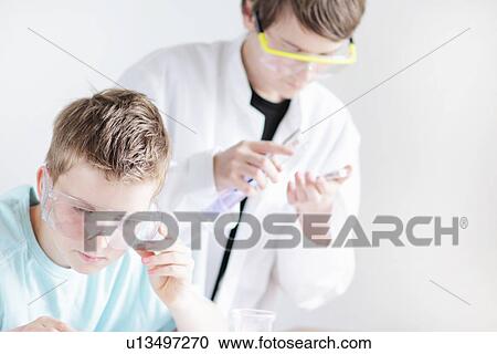 Students wearing safety goggles in lab View Large Photo Image Stock Image - Students wearing safety goggles in lab. Fotosearch