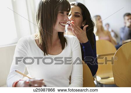 Students whispering in classroom View Large Photo Image Stock Photograph - Students whispering in classroom. Fotosearch