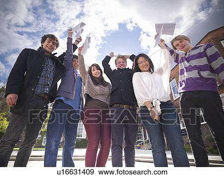 Students with grades cheering at school View Large Photo Image Stock Photo - Students with grades cheering at school. Fotosearch