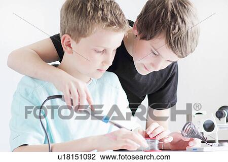 Stock Image - Students working in technology lab. Fotosearch
