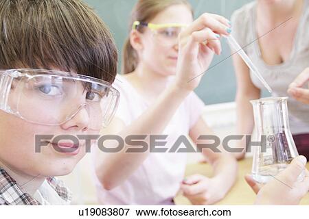 Students working with lab equipment View Large Photo Image Stock Photo - Students working with lab equipment. Fotosearch
