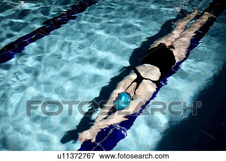 Swimmer doing laps in pool View Large Photo Image Stock Photo - Swimmer doing laps in pool. Fotosearch