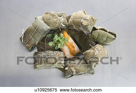 Tamales, wrapped in banana leaves View Large Photo Image Stock Photography - Tamales, wrapped in banana leaves. Fotosearch