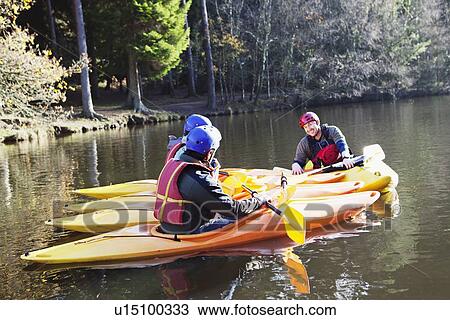 Teacher talking to students in kayaks View Large Photo Image Stock Image - Teacher talking to students in kayaks. Fotosearch