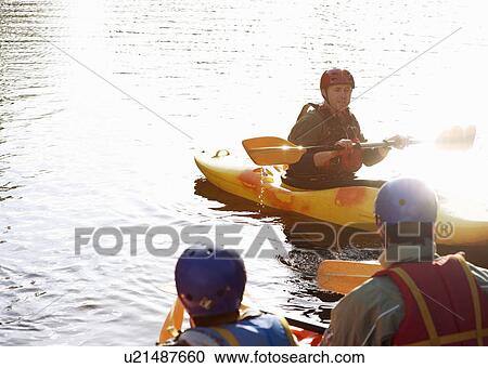 Teacher talking to students in kayaks View Large Photo Image Stock Image - Teacher talking to students in kayaks. Fotosearch