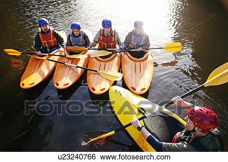 Teacher talking to students in kayaks View Large Photo Image Stock Photograph - Teacher talking to students in kayaks. Fotosearch